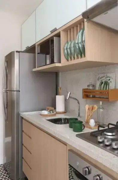 Granito branco Siena em pia com cuba pequena e cooktop (foto: Casa e Construção)